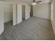 Bright bedroom featuring soft carpet, a ceiling fan, and two closets with an adjacent closet and storage space at 6941 Gallant Se Cir # 10, Mableton, GA 30126