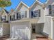 Two story home features gray vinyl siding and well manicured lawn at 6941 Gallant Se Cir # 10, Mableton, GA 30126