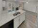 Modern kitchen with white cabinets, quartz countertops and stainless steel appliances at 6941 Gallant Se Cir # 10, Mableton, GA 30126