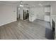 Bright open-concept living area featuring modern gray vinyl floors at 6941 Gallant Se Cir # 10, Mableton, GA 30126