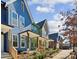 View of colorful new construction townhomes showcasing welcoming front porches at 1095 Tucker Ave # 106, Atlanta, GA 30310