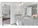 Stylish bathroom with granite double vanity, neutral walls, and view to the bedroom at 6045 Spring Way, Stonecrest, GA 30038