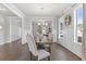 Elegant dining room features hardwood floors, natural light, and modern decor at 6045 Spring Way, Stonecrest, GA 30038