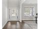 Bright foyer featuring hardwood floors, natural light and a decorative rug and table at 6045 Spring Way, Stonecrest, GA 30038