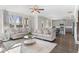 Open-concept living space with hardwood floors, neutral walls, and modern decor at 6045 Spring Way, Stonecrest, GA 30038