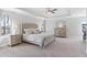 Spacious bedroom with tray ceiling, carpet flooring, large windows, and a dresser at 6045 Spring Way, Stonecrest, GA 30038