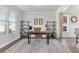 Bright home office featuring natural light, hardwood floors, and neutral walls at 6045 Spring Way, Stonecrest, GA 30038
