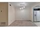 A carpeted dining area features neutral walls, modern lighting, and an adjacent kitchen at 102 Gettysburg Pl, Sandy Springs, GA 30350