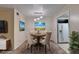 Cozy dining room with a wooden table, plush chairs, and an elegant pendant light fixture at 102 Gettysburg Pl, Sandy Springs, GA 30350
