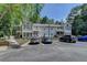 Traditional condo building featuring a well-manicured lawn and convenient parking at 102 Gettysburg Pl, Sandy Springs, GA 30350