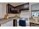 The kitchen features dark cabinets and a white gas range stove at 102 Gettysburg Pl, Sandy Springs, GA 30350