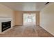 Bright living room featuring a fireplace, bay window, and carpet flooring at 102 Gettysburg Pl, Sandy Springs, GA 30350