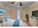 A staged main bedroom with neutral walls, a ceiling fan, and a serene decor at 102 Gettysburg Pl, Sandy Springs, GA 30350