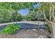 Community Tennis court surrounded by mature trees at 102 Gettysburg Pl, Sandy Springs, GA 30350