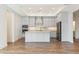 Bright, spacious kitchen with stainless steel appliances, a large island, and light gray cabinets at 5245 Maggie Mae Ln, Cumming, GA 30028
