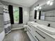 Modern bathroom with double vanity and subway tile at 4503 Balmoral Nw Rd, Kennesaw, GA 30144