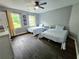 Guest bedroom with two twin beds and dark hardwood floors at 4503 Balmoral Nw Rd, Kennesaw, GA 30144