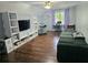 Versatile bonus room with built-in shelving, a large TV, and comfortable seating at 4503 Balmoral Nw Rd, Kennesaw, GA 30144