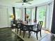 Sunlit dining room with a wooden table and bay windows at 4503 Balmoral Nw Rd, Kennesaw, GA 30144