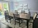 Bright dining room with hardwood floors and a large table at 4503 Balmoral Nw Rd, Kennesaw, GA 30144