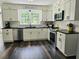 Modern kitchen with white cabinets and dark countertops at 4503 Balmoral Nw Rd, Kennesaw, GA 30144