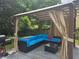 Relaxing outdoor space with a covered pergola, comfortable seating and a grill at 4503 Balmoral Nw Rd, Kennesaw, GA 30144