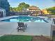 Community swimming pool with lounge chairs and surrounding patio at 4503 Balmoral Nw Rd, Kennesaw, GA 30144