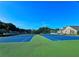 Two blue tennis courts with green surrounding at 4503 Balmoral Nw Rd, Kennesaw, GA 30144