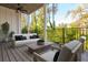 Relaxing outdoor deck with wooded views at 220 Alcovy Ter, Alpharetta, GA 30009