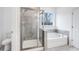 Bathroom with a walk-in shower and soaking tub at 5060 Trescott Path, Cumming, GA 30028
