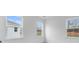 Bright bedroom with three windows and neutral walls at 5060 Trescott Path, Cumming, GA 30028