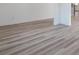 Light grey wood-look plank flooring throughout the home at 5060 Trescott Path, Cumming, GA 30028