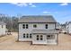 Two-story house with grey siding and covered patio at 5060 Trescott Path, Cumming, GA 30028