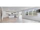 Open floor plan with kitchen and living area, featuring hardwood floors and a fireplace at 5060 Trescott Path, Cumming, GA 30028