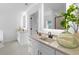 Modern bathroom featuring double vanities, white cabinets, quartz countertops, and LED lighting at 3378 Pepperpike Ct, Loganville, GA 30052