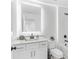 Bathroom with illuminated mirror, quartz countertop vanity, white cabinets, toilet, and shower-tub combo at 3378 Pepperpike Ct, Loganville, GA 30052