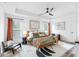 Bright, spacious bedroom with a decorative ceiling fan, modern decor, and ample natural light at 3378 Pepperpike Ct, Loganville, GA 30052