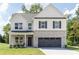 Charming two-story home with gray brick accents and a covered front porch at 3378 Pepperpike Ct, Loganville, GA 30052