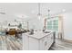 Open kitchen featuring a large island with bar seating and modern appliances at 3378 Pepperpike Ct, Loganville, GA 30052