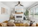 Bright living room boasts a modern fireplace, comfortable seating, and large windows at 3378 Pepperpike Ct, Loganville, GA 30052