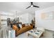 Open-concept living space with modern decor, comfortable seating, and a connected kitchen at 3378 Pepperpike Ct, Loganville, GA 30052