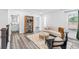 Spacious living area features modern furnishings, neutral walls, hardwood style floors and lots of light at 3378 Pepperpike Ct, Loganville, GA 30052