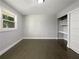 This bedroom has hardwood floors, a large window, and a built-in desk at 2492 Brentwood Ct, Decatur, GA 30032