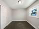 This is a cozy bedroom with hardwood floors, a window, and a closet at 2492 Brentwood Ct, Decatur, GA 30032