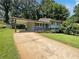 Charming home with a covered parking area, landscaped yard, and a long driveway at 2492 Brentwood Ct, Decatur, GA 30032
