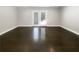 Bright living room featuring access to the backyard and freshly refinished hardwood floors at 2492 Brentwood Ct, Decatur, GA 30032