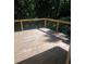 Spacious wooden back deck with cable railings overlooking a wooded area for peaceful outdoor enjoyment at 1041 Kennesborough Nw Rd, Kennesaw, GA 30144