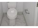 This bathroom has a modern toilet with brushed nickel fixtures and clean marble tile flooring at 1041 Kennesborough Nw Rd, Kennesaw, GA 30144
