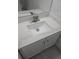 The bathroom features a quartz countertop vanity, a sleek faucet, and white cabinets at 1041 Kennesborough Nw Rd, Kennesaw, GA 30144