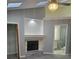 Bedroom showcasing a fireplace, chandelier lighting, and access to a private bathroom at 1041 Kennesborough Nw Rd, Kennesaw, GA 30144